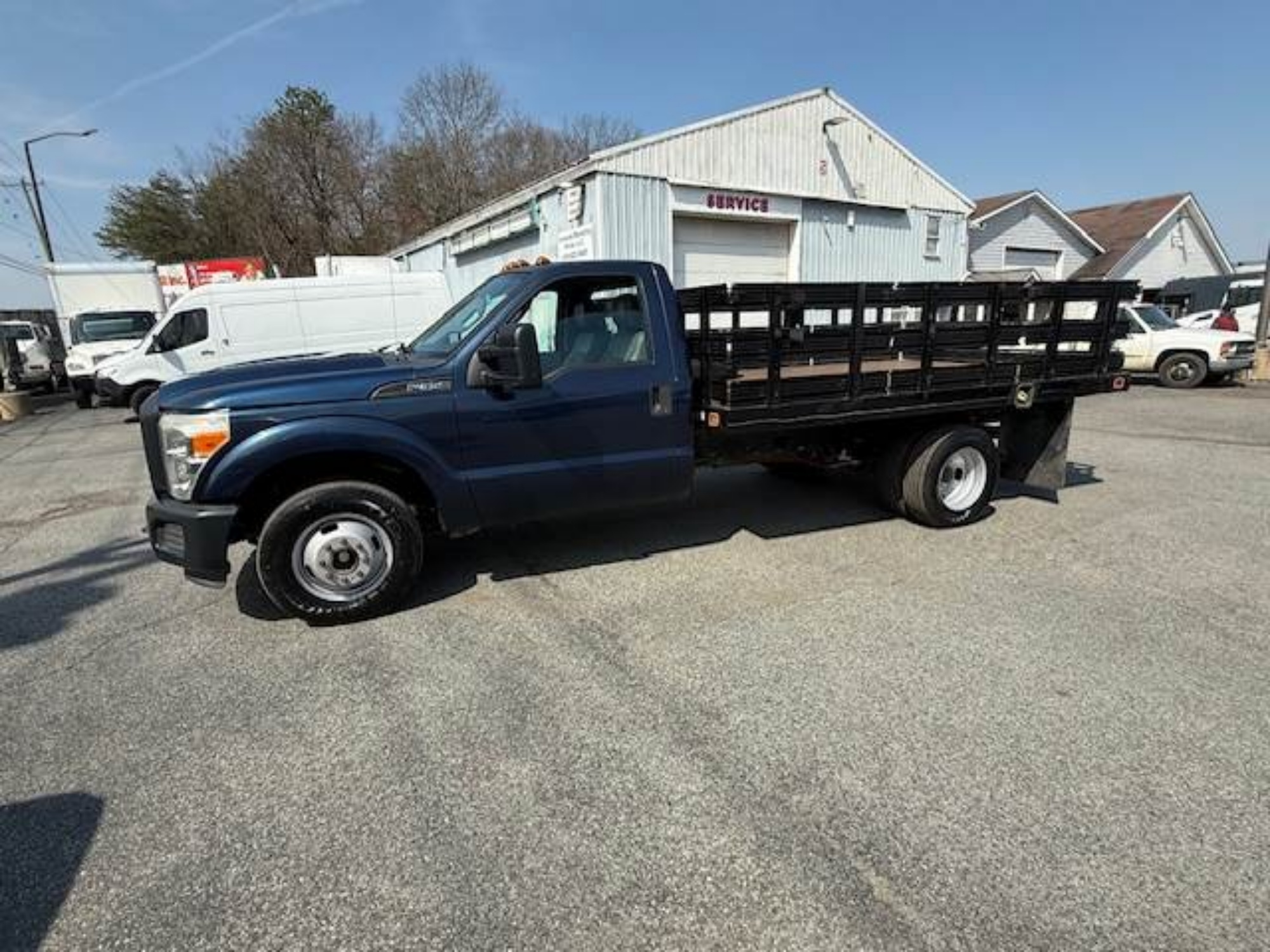 Picture of 2015 Ford F-350 Stake Bed Truck, Under CDL, Automatic, Delivery, Moving, 12FT Bed Gas, Hauler, Mulch, Landscape, Construction, Low Miles, Government Ford V-Shaped